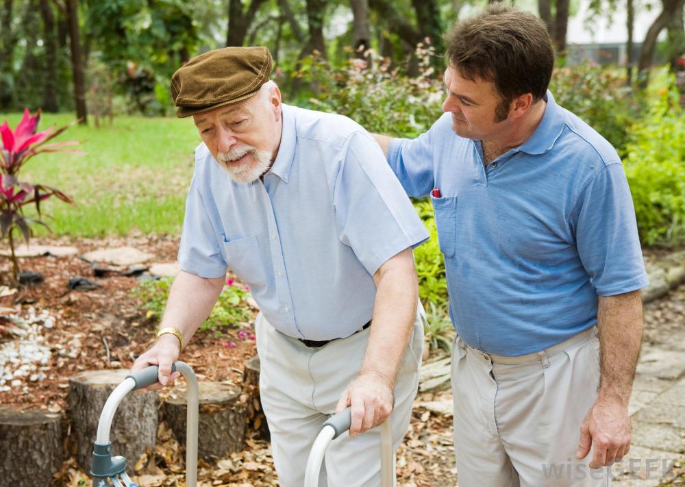 man-in-blue-shirt-with-old-man-and-walker